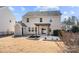 An exterior view of a home's backyard featuring a pergola and a small storage shed at 5011 Tatton Ln, Indian Land, SC 29707