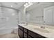 Bathroom boasts double sinks, a shower/tub combo, and a large mirror at 5011 Tatton Ln, Indian Land, SC 29707