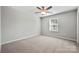 Simple bedroom with ceiling fan and a window offering natural light at 5011 Tatton Ln, Indian Land, SC 29707