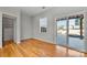 Bright bedroom with hardwood floors, closet, and sliding door to patio at 5011 Tatton Ln, Indian Land, SC 29707