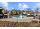 Community pool featuring a mushroom fountain and a nearby playground in a Gathering-friendly area at 5011 Tatton Ln, Indian Land, SC 29707