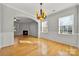 Bright dining room with hardwood floors and fireplace view at 5011 Tatton Ln, Indian Land, SC 29707