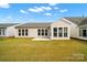 Backyard of house with new lawn, patio, and new exterior paint at 20195 Dovekie Ln, Fort Mill, SC 29707