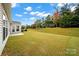 House with new lawn, landscaping, and freshly painted trim in backyard at 20195 Dovekie Ln, Fort Mill, SC 29707