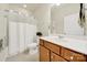 Bathroom boasts a white vanity, a toilet, and a shower with a white curtain at 20195 Dovekie Ln, Fort Mill, SC 29707
