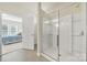 This bathroom features a glass shower door and access to a bedroom at 20195 Dovekie Ln, Fort Mill, SC 29707