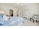 Relaxing bedroom featuring a comfortable bed, soft carpet, and a bright window view at 20195 Dovekie Ln, Fort Mill, SC 29707
