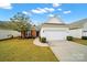 Charming home with a two-car garage and manicured front lawn at 20195 Dovekie Ln, Fort Mill, SC 29707
