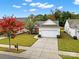 Aerial view of house showcasing landscaped front yard and two car garage at 20195 Dovekie Ln, Fort Mill, SC 29707