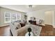 Bright living room with large windows, comfortable seating, and a decorative rug at 20195 Dovekie Ln, Fort Mill, SC 29707