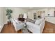 Spacious living room featuring hardwood floors, comfortable seating, and stylish decor at 20195 Dovekie Ln, Fort Mill, SC 29707