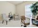 The office has a chair, end table, lamp, side chair and large window at 20195 Dovekie Ln, Fort Mill, SC 29707