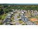 Aerial view of neighborhood showcasing lush greenery around this property with a large backyard and sports court at 3157 Delaware Dr, Denver, NC 28037