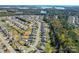 Aerial view of a community with a lake and a property with a well-maintained lawn and backyard at 3157 Delaware Dr, Denver, NC 28037