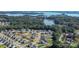 Stunning aerial view showcasing the community's prime location near the serene lake and lush greenery at 3157 Delaware Dr, Denver, NC 28037