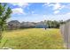 Expansive backyard showing sports net, basketball court, fire pit and a lush lawn at 3157 Delaware Dr, Denver, NC 28037