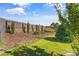 View of backyard with decorative landscaping and wooden privacy fence at 3157 Delaware Dr, Denver, NC 28037