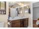 Bathroom features a double sink vanity with framed mirrors and a separate toilet room at 3157 Delaware Dr, Denver, NC 28037