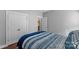 Cozy bedroom featuring a comfortable bed, closet, and access to the bathroom at 3157 Delaware Dr, Denver, NC 28037