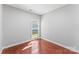 Empty bedroom featuring a window, hardwood floors, and neutral walls at 3157 Delaware Dr, Denver, NC 28037