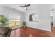 Bright dining area with hardwood floors, large windows, and access to the kitchen at 3157 Delaware Dr, Denver, NC 28037