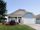 Charming two-story home with manicured lawn and a two-car garage in a desirable neighborhood at 3157 Delaware Dr, Denver, NC 28037