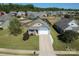Aerial view of a charming home with a well-manicured front lawn and a long driveway at 3157 Delaware Dr, Denver, NC 28037