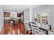 Open concept kitchen and dining area, featuring wood floors and stainless steel appliances at 3157 Delaware Dr, Denver, NC 28037