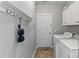 The laundry room features tile floors, washer and dryer, and overhead storage at 3157 Delaware Dr, Denver, NC 28037