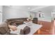 Spacious living room featuring a large sectional sofa, hardwood floors, and ample natural light at 3157 Delaware Dr, Denver, NC 28037
