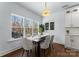 Bright dining room with large windows and seating for six at 8508 Tirzah Church Rd, Waxhaw, NC 28173