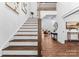 Elegant staircase with modern railing, leading to upper level at 8508 Tirzah Church Rd, Waxhaw, NC 28173