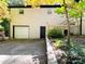 Rear view of a two-story home with a brick exterior and detached garage at 508 Deese St, Monroe, NC 28112