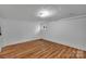 Spacious basement area features finished flooring and a small window for natural light at 508 Deese St, Monroe, NC 28112
