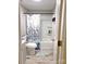 Bright bathroom features a shower-tub combination, white cabinets, and wood-look flooring at 508 Deese St, Monroe, NC 28112