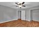 Bedroom with hardwood floors and access to multiple closets and storage spaces at 508 Deese St, Monroe, NC 28112