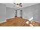 Spacious bedroom featuring hardwood floors and access to a closet and bathroom at 508 Deese St, Monroe, NC 28112