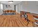 Open dining and living area with a wooden table, tan chairs, and wood floors at 508 Deese St, Monroe, NC 28112
