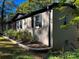 Side of house showing brick exterior, black shutters, and landscaping at 508 Deese St, Monroe, NC 28112