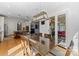 Kitchen with breakfast area and glass-top table, leading to backyard access at 18528 Nantz Rd, Cornelius, NC 28031