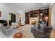 Elegant living room with a large fireplace, built-in shelving, and ample seating at 18528 Nantz Rd, Cornelius, NC 28031