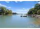 Serene waterfront view with private dock, perfect for boating and relaxation at 18528 Nantz Rd, Cornelius, NC 28031