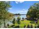 Stunning view of the lake, with lush greenery and boats in the distance at 18528 Nantz Rd, Cornelius, NC 28031