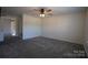 Spacious bedroom with grey carpet, ceiling fan and barn door at 1924 Lakeview Dr, Rock Hill, SC 29732