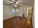 Hardwood floor bedroom with ceiling fan and mirrored closet at 1924 Lakeview Dr, Rock Hill, SC 29732