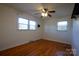 Spacious bedroom with hardwood floors, ceiling fan and two windows at 1924 Lakeview Dr, Rock Hill, SC 29732