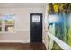 Inviting entryway with dark stained hardwood floors and nature-themed wall art at 1924 Lakeview Dr, Rock Hill, SC 29732