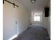 Bright hallway with carpet and barn door at 1924 Lakeview Dr, Rock Hill, SC 29732