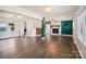 Spacious living room with dark hardwood floors, fireplace, and green accent wall at 1924 Lakeview Dr, Rock Hill, SC 29732