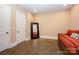 This bedroom features a modern full-length mirror and is decorated with a red daybed at 7029 Pebble Bay Dr, Denver, NC 28037